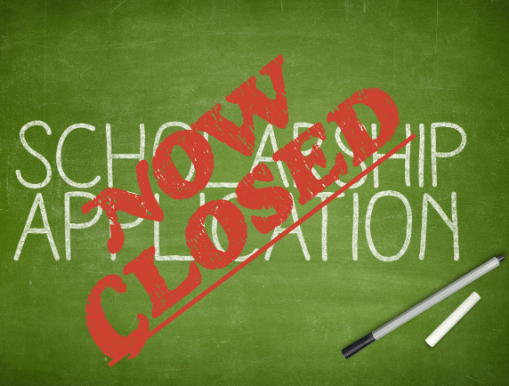 Scholarship Application" written on chalkboard with "Now Closed" stamped in red across it.